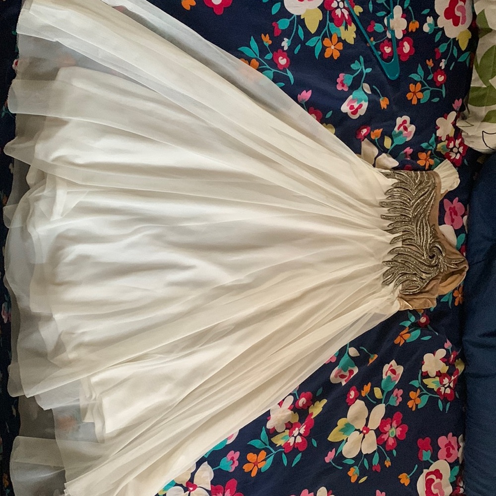 Long formal white dress for girls from 9-12, with purple gemstones on bust